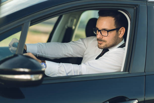 istock Businessman driving a car 1168161079