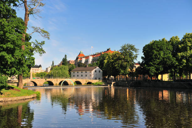 istock Landscape with an old bridge on river, Orebro, Sweden 1168162215