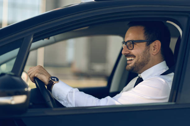 istock Happy businessman driving a car 1168162455