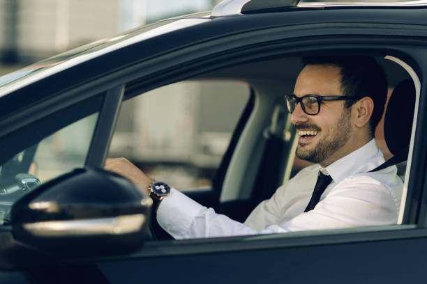 istock Happy businessman driving a car 1168162492