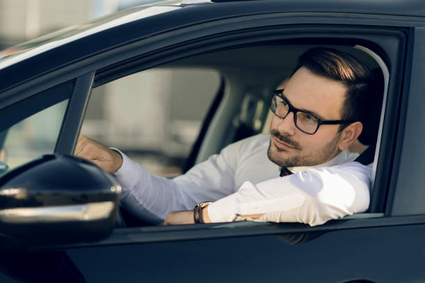 istock Businessman driving a car 1168162521