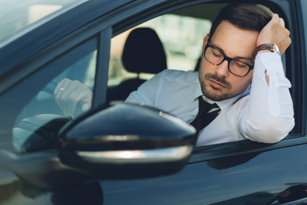 istock Tired man driving a car 1168162750