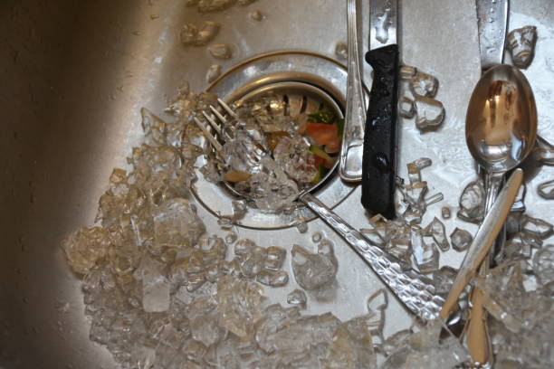istock A glass shattered to pieces in the sink 1168164505