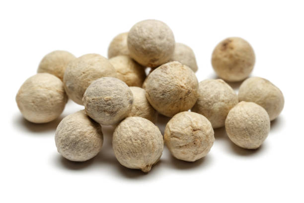 Heap of white peppercorn isolated on white background