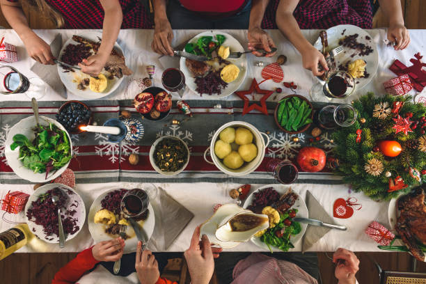 istock family dining at christmas table 1168166068