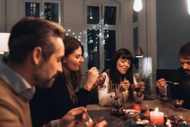 istock friends at christmas table 1168166898