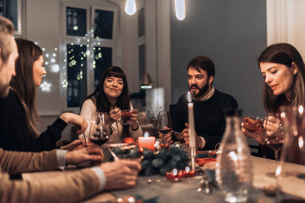 istock friends having desert at christmas table 1168167463