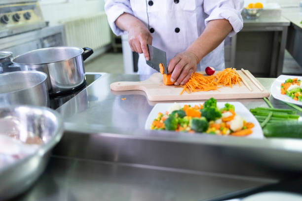 istock Chef preparing salad in chinese restaurant 1168169197