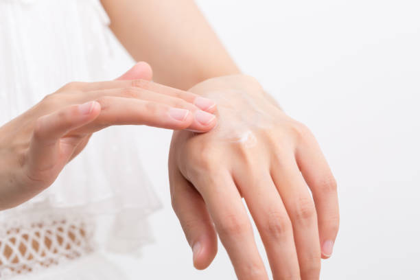 istock Female applying cream to her hands 1168171238
