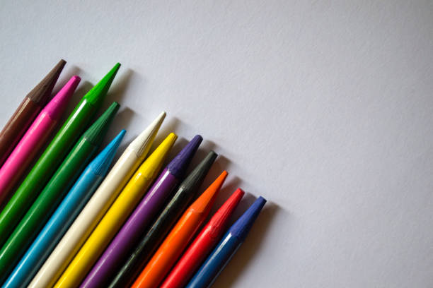 istock Multicolored pencils on white background. A palette of pencils on a table, close up. 1168174668