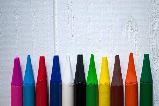 istock Multicolored pencils on white background. A palette of pencils on a table, close up. 1168175164