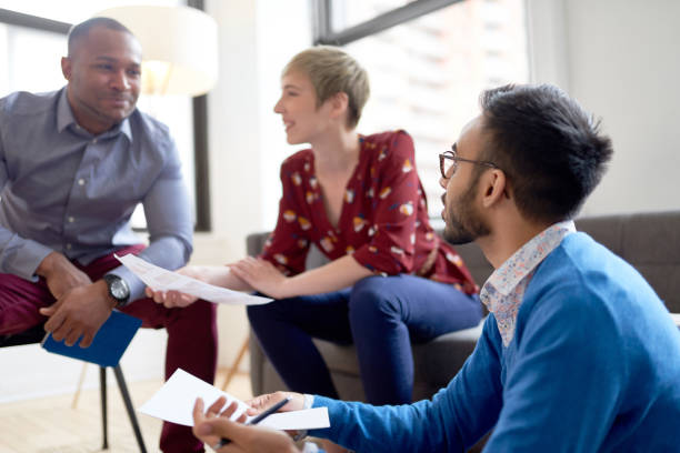 istock Multi-ethnic team of creative millenials collaborating on a brainstorm project 1168175814