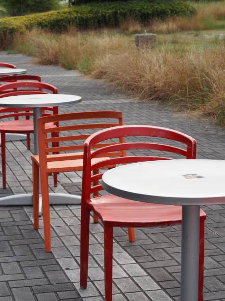 istock Tables and chairs in a row on the pathway 1168181660