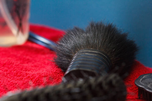 Hairdresser tools on black background with copy space in center