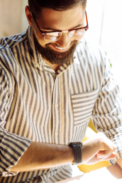 istock Good looking nice man wanting to know the time 1168184763