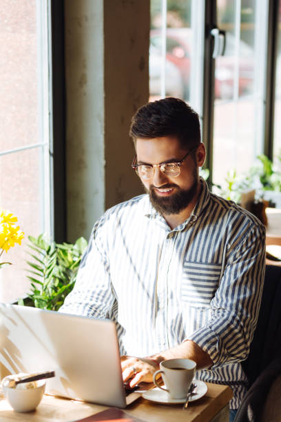 istock Delighted positive man looking at the keyboard 1168184847