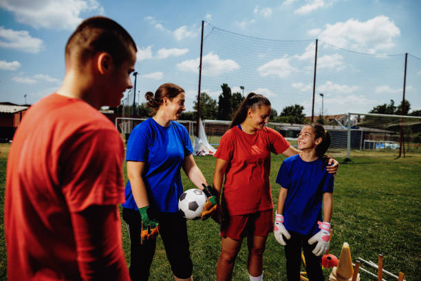 istock Female trainer with goalkeepers before the soccer game 1168187135