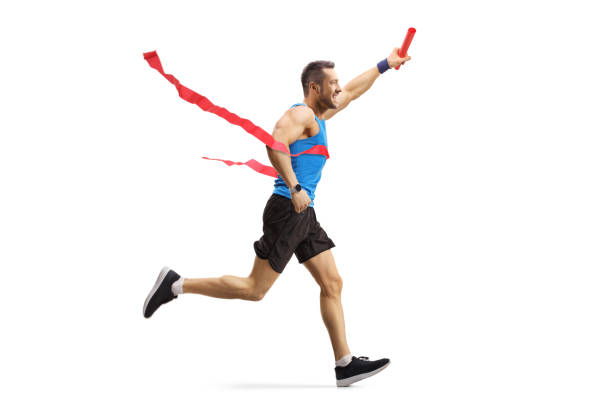 istock Young man finishing a relay race and holding a baton 1168187793
