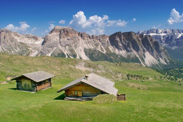 istock Beautiful summer mountain scenery with two huts. Dolomites Italy 1168188858