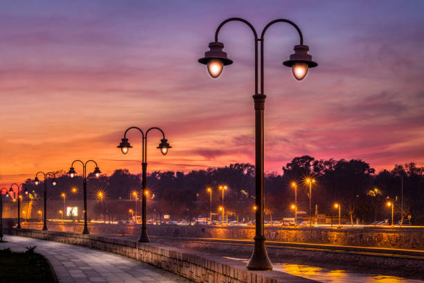 Nis. Serbia, November 24, 2017. Nis quay and city lanterns at sunset.