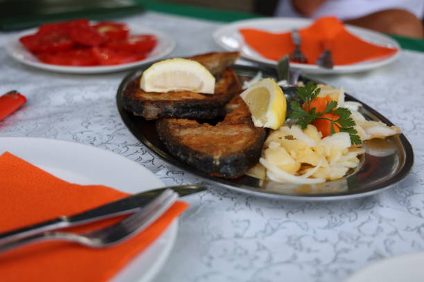 istock Grilled fish with potato salad 1168191142