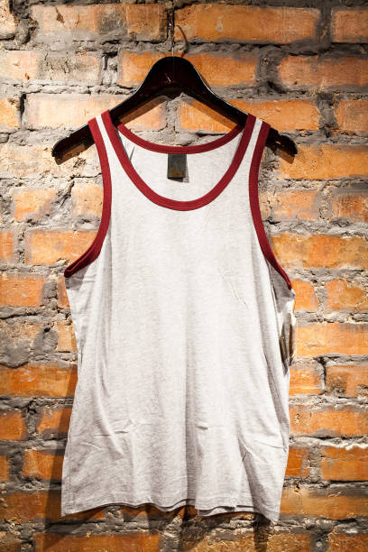 istock White blank t-shirt hanging on a red brick wall 1168196187