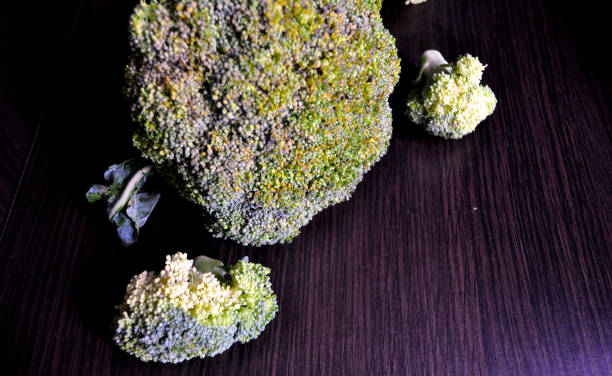 istock fresh cauliflower and broccoli on a dark background 1168198108