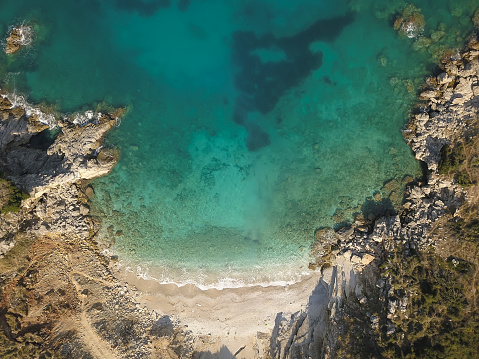 Beautiful seascape. Beach on coast of Ionian Sea in Albania, Ksamil, near Greece island Korfu. Birdseye view of Mirror Beach (Pasqyra) in Saranda, Albania (Albanian Riviera) View from drone