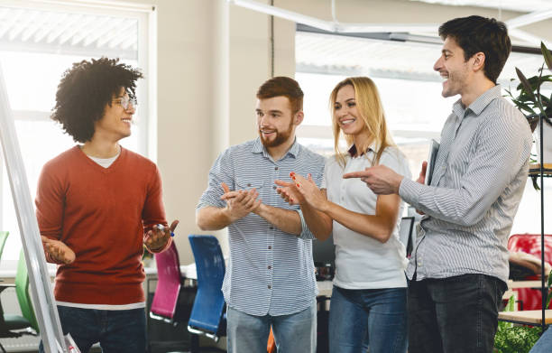 istock Business team appreciating colleague for explaining presentation 1168201665