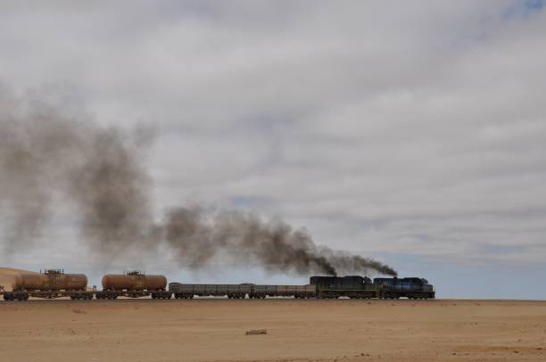 istock Train against sand dune, Namib Desert 1168203109