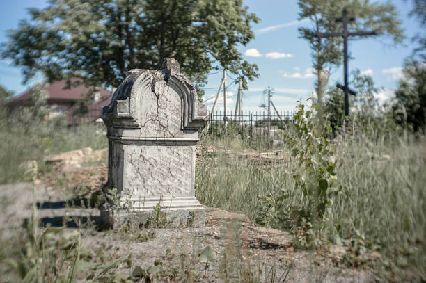 istock very old cracked gray stone tombstone on a sunny day 1168204492