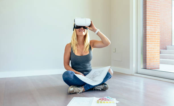 istock Woman watching with virtual reality glasses 1168206146