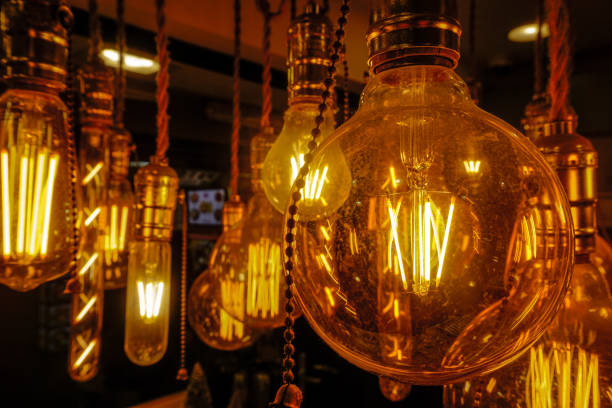 istock Glowing lamps in a dark room 1168207801