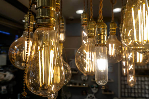 istock Glowing lamps in a dark room 1168208937