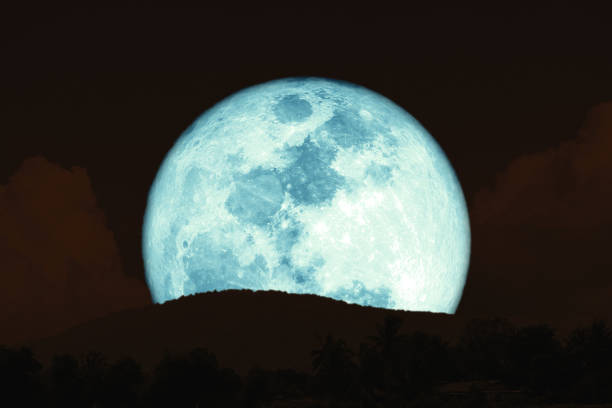 istock super full harvest moon on night sky back silhouette mountain 1168214694