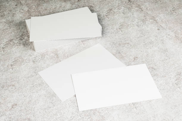 istock Closeup of blank card on concrete desktop 1168214812