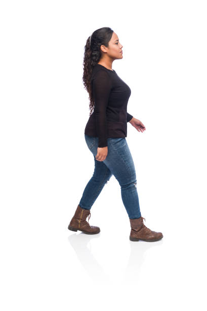 istock Young woman walking 1168214874