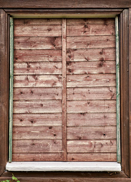 istock Very old window with wooden shutters. Untidy primitive window. 1168216759