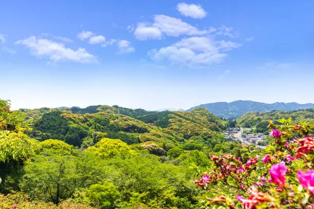 Photo of Takeo city with blue sky, skyline top view from Mifuneyama Rakuen in Saga Prefecture, Kashima, Kyushu Japan.