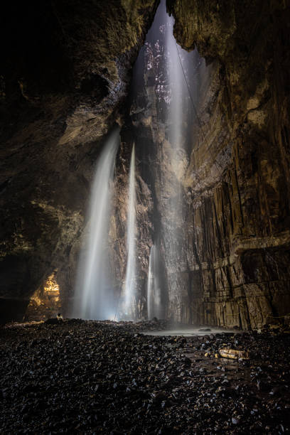 Gaping Gill Cave Inside Gaping Gill in Yorkshire one of the UK's largest underground chambers which is accessed through a pothole 98m (322ft) deep ingleborough stock pictures, royalty-free photos & images
