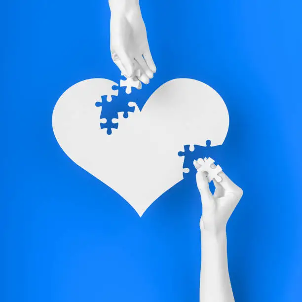 Photo of Creating a family, heart shape love concept, relationship building between man and woman, charity, collect the heart in pieces. 3d illustration