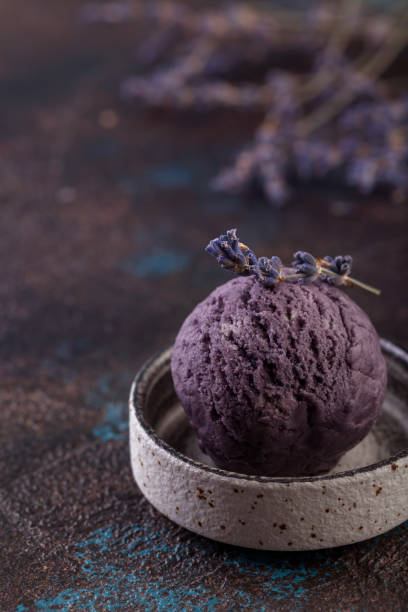 istock lavender ice-cream in round grey plate on brown background 1168219422