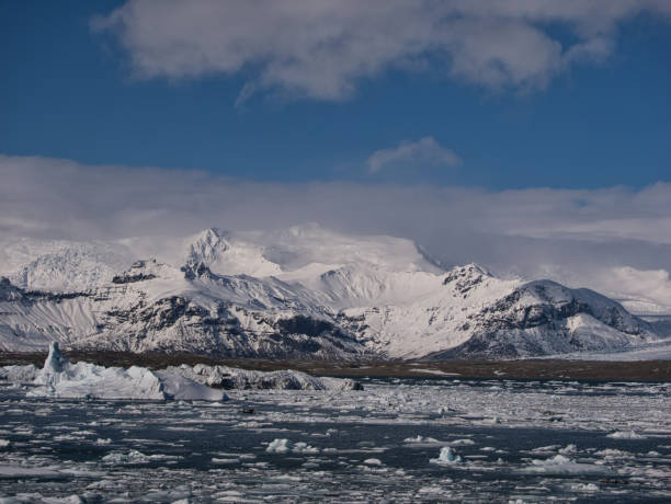 istock Snow-covered mountains behind the glacier lagoon 1168219486