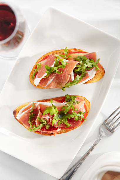 istock Bruschetta with Parma Ham and Parmesan Cheese 1168222642