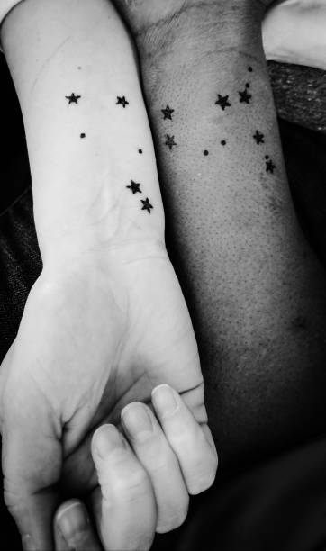 Astrology Tattoos on Wrists Libra and Gemini astrology tattoos black and white wrist tattoo stock pictures, royalty-free photos & images