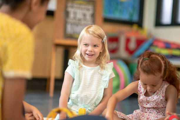 istock Multi-ethnic group of preschool students in class 1168222993
