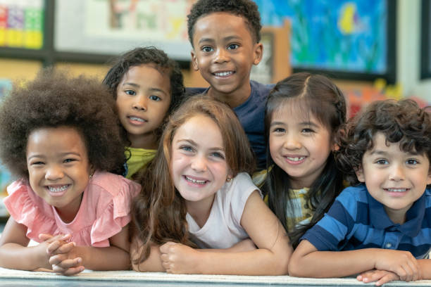istock Group of smiling preschool students 1168222996