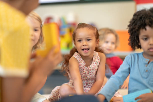 istock Multi-ethnic group of preschool students in class 1168223012