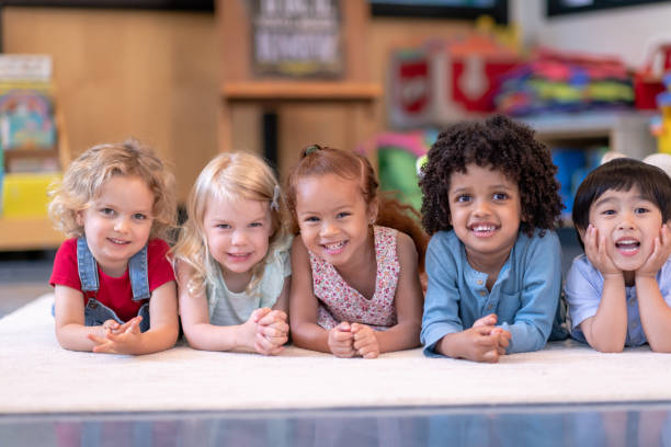 istock Group of smiling preschool students 1168223014
