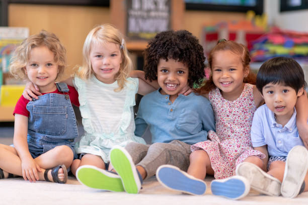 istock Group of smiling preschool students 1168223029
